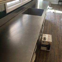 STAINLESS STEEL COUNTERTOP INSTALLATION WITH WELDED SINK