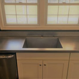 STAINLESS STEEL COUNTERTOP INSTALLATION WITH WELDED SINK