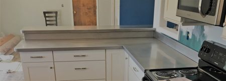 STAINLESS STEEL COUNTERTOP INSTALLATION WITH WELDED SINK